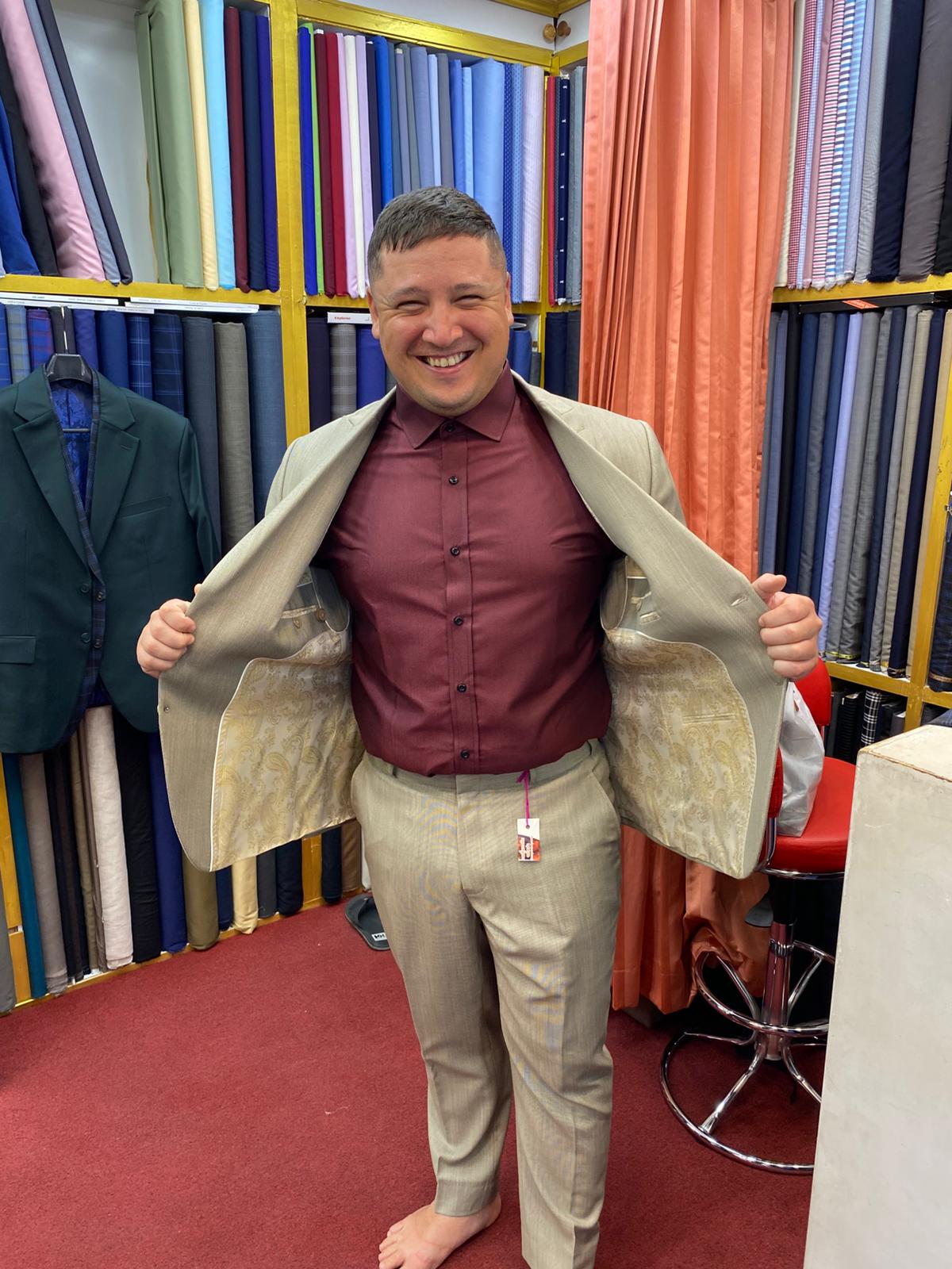 Happy client in custom tailored suit at King Fashion Uni Bangkok
